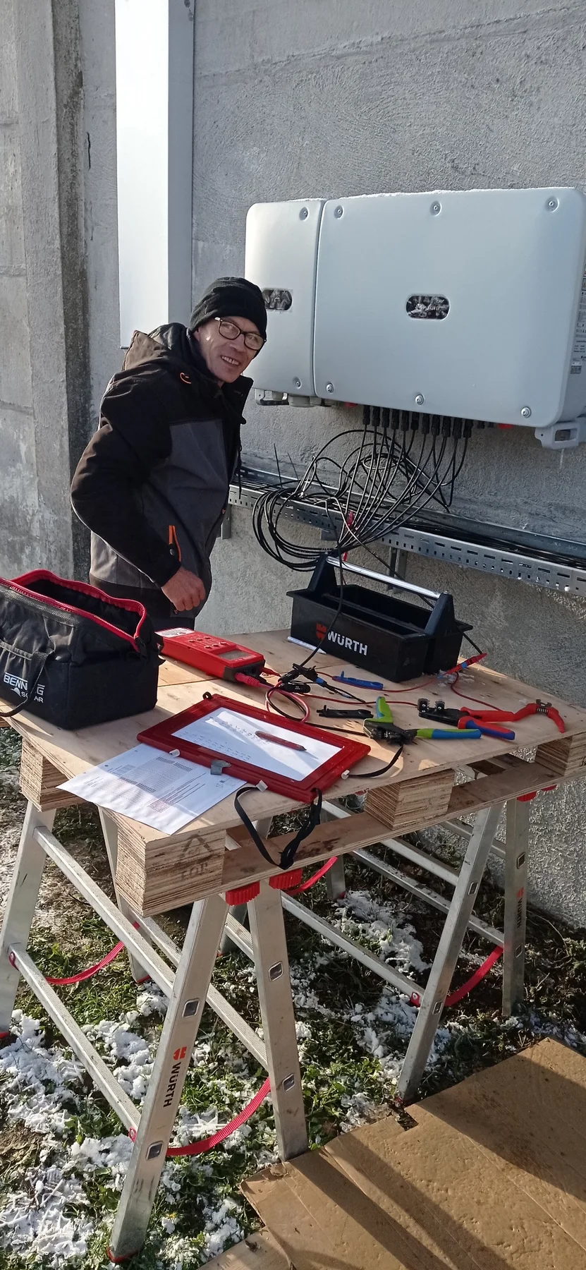 A-G-BAU technician working with photovoltaic system equipment